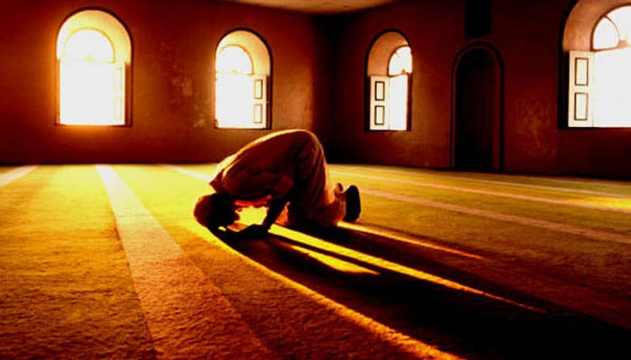 Muslim man prays in mosque
