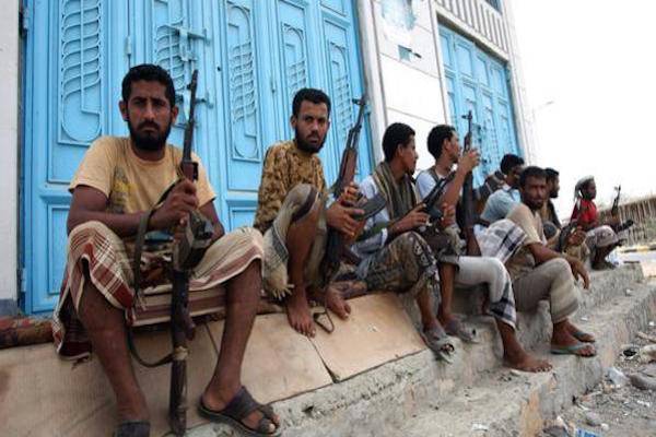 Yemeni armed tribesmen loyal to the army sit on the corner of a street in the southern Yemeni city of Zinjibar on June 14, 2012. The Yemeni military drove the jihadists out of the provincial capital of Zinjibar and Jaar two days earlier, with Al-Qaeda gunmen believed to have fled east to the town of Shuqra in Yemen's southern province of Abyan where Al-Qaeda and the army are battling for control of the restive territory. AFP PHOTO/ MOHAMMED HUWAIS        (Photo credit should read MOHAMMED HUWAIS/AFP/GettyImages)